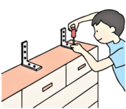 壁に家具を固定する人のイラスト